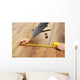 Carpenter worker installing laminate flooring in the room Wall Decal