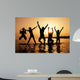 Silhouette of kids jumping on the beach Wall Decal