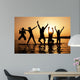Silhouette of kids jumping on the beach Wall Decal