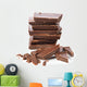 Broken chocolate bar on a white background Wall Decal
