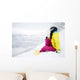 snowboarder woman sitting on snow mountain slope Wall Decal