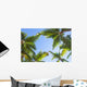 Looking up on coconut palm trees over blue sky background Wall Decal