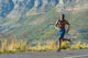 Athletic,  black male running along a road Wall Decal