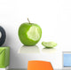 Green apple with bite taken out, on white Wall Decal