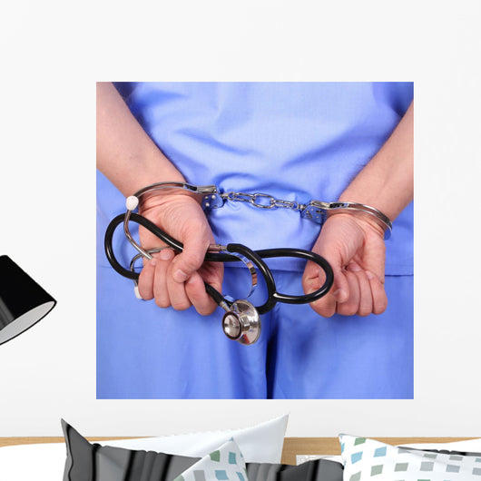 Doctor with stethoscope in handcuffs Wall Decal
