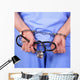 Doctor with stethoscope in handcuffs Wall Decal