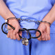 Doctor with stethoscope in handcuffs Wall Decal