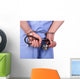 Doctor with stethoscope in handcuffs isolated on white Wall Decal