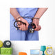 Doctor with stethoscope in handcuffs isolated on white Wall Decal