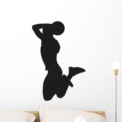 Basketball Player Dunk Silhouette Wall Decal shown on a wall