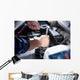 Mechanic working in auto repair garage Wall Decal