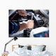 Mechanic working in auto repair garage Wall Decal