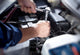Mechanic working in auto repair garage Wall Decal
