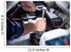 Mechanic working in auto repair garage Wall Decal
