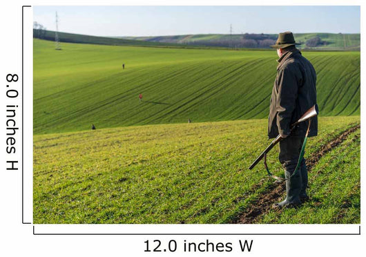Gamekeeper walks over field. Wall Decal