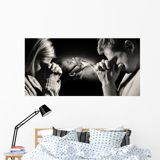 Parents pray for the health of seriously ill daughter. Wall Decal