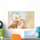 Glasses of champagne in female hands on a party Wall Decal