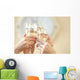 Glasses of champagne in female hands on a party Wall Decal