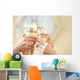 Glasses of champagne in female hands on a party Wall Decal