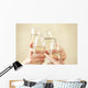 Glasses of champagne in female hands on a party Wall Decal