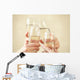 Glasses of champagne in female hands on a party Wall Decal