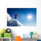 Mountaineer celebrates the conquest of the summit. Wall Decal