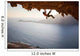 Rock climber climbing along roof in cave at sunset Wall Decal