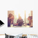 Young group of people/architects discussing business plans. Wall Decal