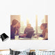 Young group of people/architects discussing business plans. Wall Decal