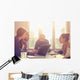 Young group of people/architects discussing business plans. Wall Decal