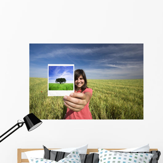 young woman smiling holding single polaroid film strip Wall Decal