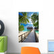 Bridge leading to overwater bungalow in blue lagoon Wall Decal