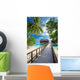 Bridge leading to overwater bungalow in blue lagoon Wall Decal