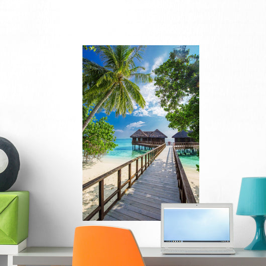 Bridge leading to overwater bungalow in blue lagoon Wall Decal