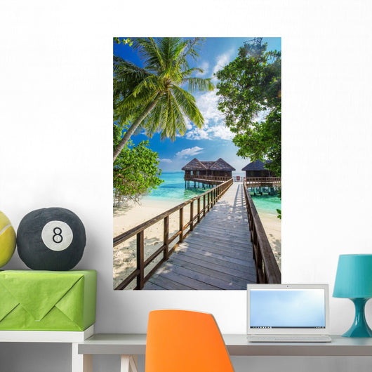 Bridge leading to overwater bungalow in blue lagoon Wall Decal