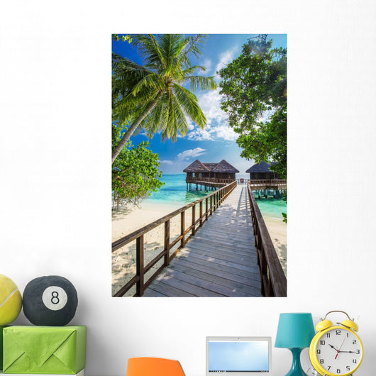 Bridge leading to overwater bungalow in blue lagoon Wall Decal