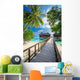 Bridge leading to overwater bungalow in blue lagoon Wall Decal