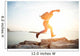 brave man running over rocks near ocean in beautiful sunset Wall Decal