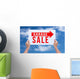 Two hands holding brown cardboard with garage sale on blue sky b Wall Decal
