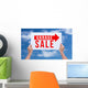 Two hands holding brown cardboard with garage sale on blue sky b Wall Decal