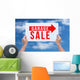 Two hands holding brown cardboard with garage sale on blue sky b Wall Decal