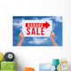Two hands holding brown cardboard with garage sale on blue sky b Wall Decal