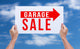 Two hands holding brown cardboard with garage sale on blue sky b Wall Decal
