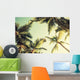 Coconut palm trees and shining sun over bright sky Wall Decal