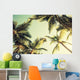 Coconut palm trees and shining sun over bright sky Wall Decal