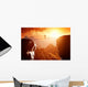 Man walking and balancing on rope over precipice in mountains Wall Decal