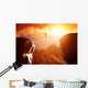 Man walking and balancing on rope over precipice in mountains Wall Decal