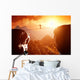 Man walking and balancing on rope over precipice in mountains Wall Decal