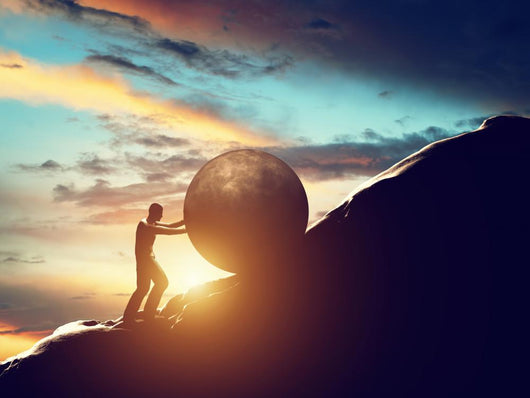 Sisyphus metaphor. Man rolling huge concrete ball up hill. Wall Decal