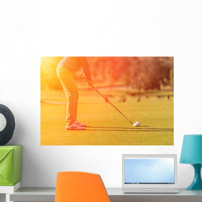 Golf Player Tee Off At Sunset Wall Decal shown on a wall